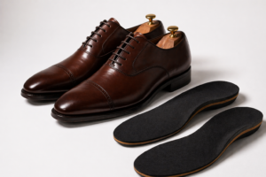 Premium leather formal shoes with slim insoles placed on a clean white background